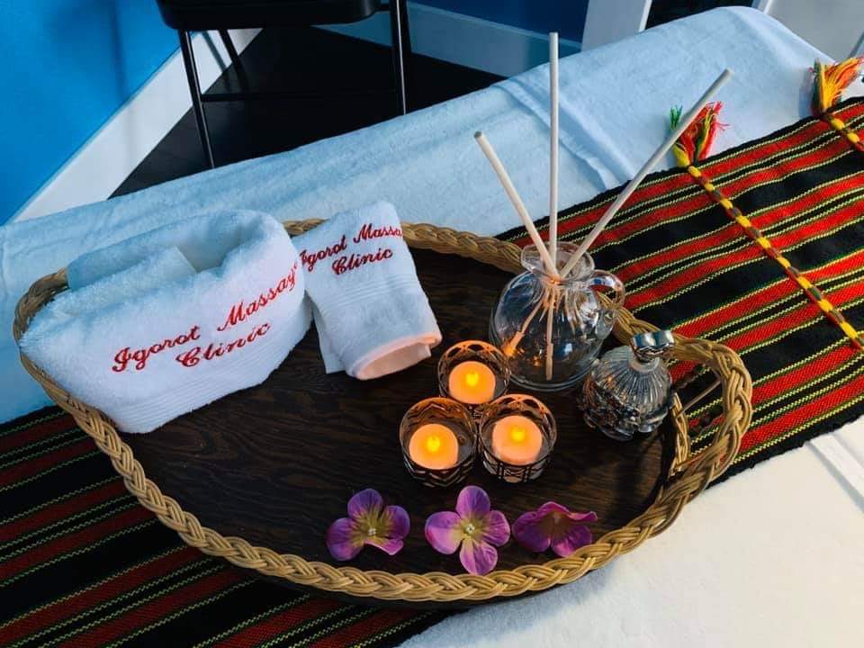 Igorot Massage Clinic branded towels and treatment setup